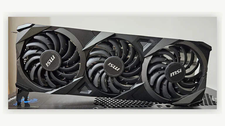 Triple-fan graphics card used as a representative photo for a 1080p GPU buying guide.