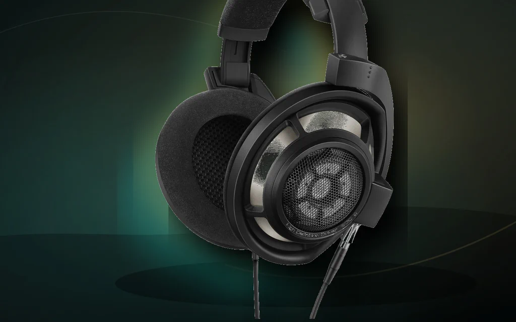 Premium open-back headphones on a dark studio-style background.