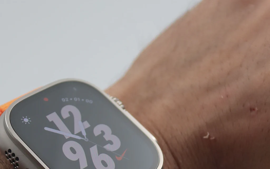 A premium smartwatch on a wrist, used as the cover for the smartwatch versus fitness tracker buying guide.