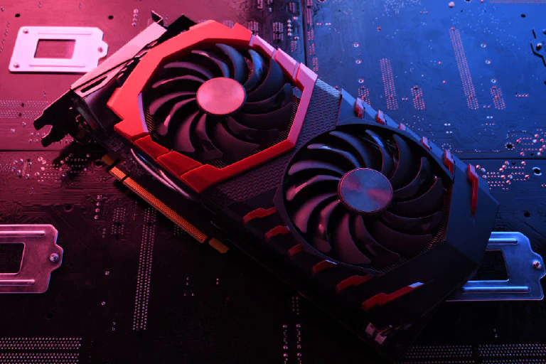 A high-end graphics card with glowing RGB lighting installed in a clean, modern PC case.