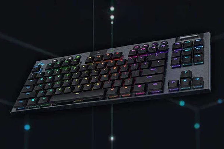 The ultra-thin Logitech G915 TKL keyboard on a clean, minimalist desk setup.