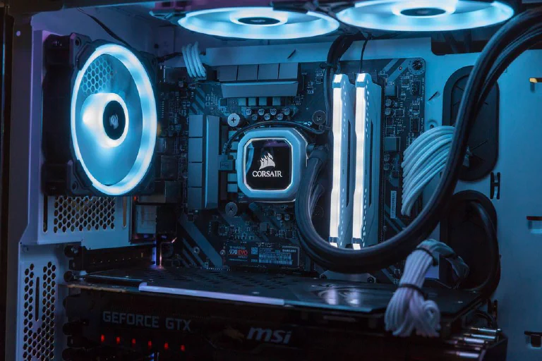 A high-end NVMe SSD being installed into a motherboard, glowing with futuristic light.