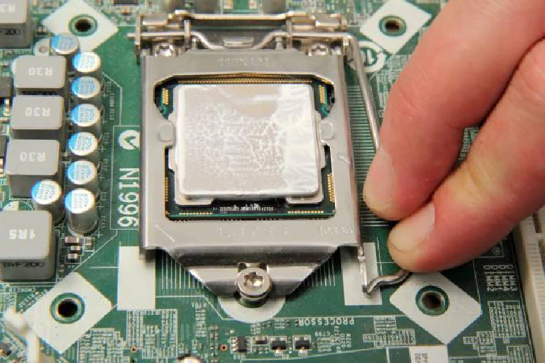 A modern CPU being carefully placed into a motherboard socket, with green energy efficiency lines glowing around it.