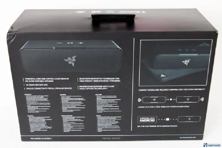 A close-up of a Razer product's serial number sticker, with a blurred background showing gaming gear.